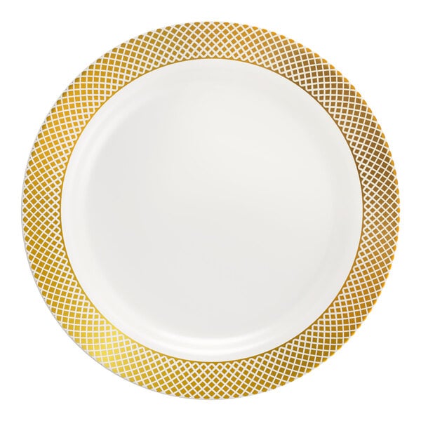 A round bone or ivory plastic plate with a gold lattice design around the rim.