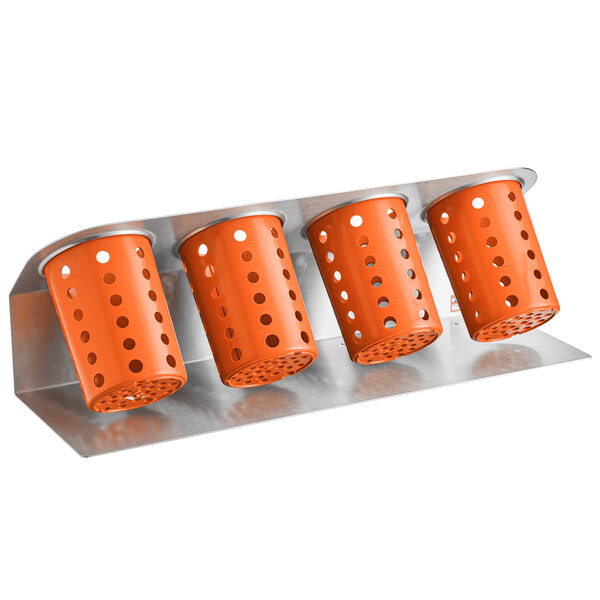 A Steril-Sil stainless steel flatware organizer with four orange cylindrical containers.