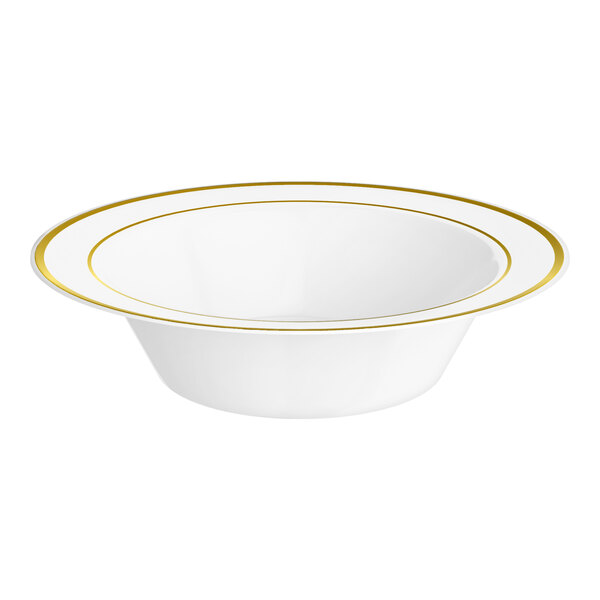 A white plastic bowl with gold bands around the rim.