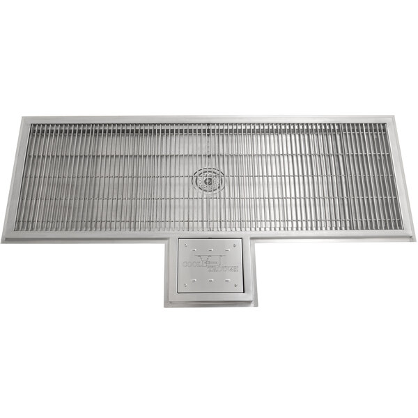 A stainless steel Eagle Group water tempering system with a metal grate.
