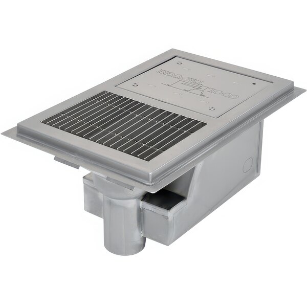 A metal Eagle Group water tempering system with a stainless steel grating over a drain hole.