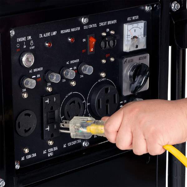 A hand plugging a yellow cable into a DuroStar portable generator.