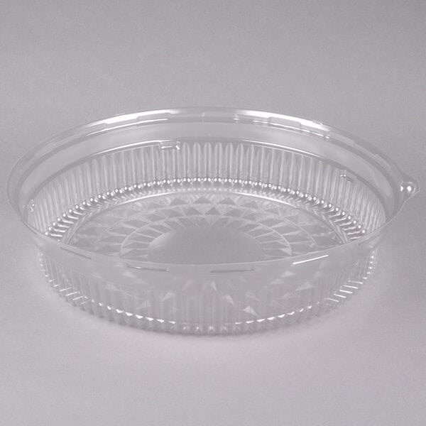 A clear plastic container with a round lid.