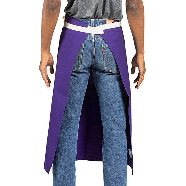 A person wearing a purple Uncommon Chef Marvel bistro apron with natural webbing.
