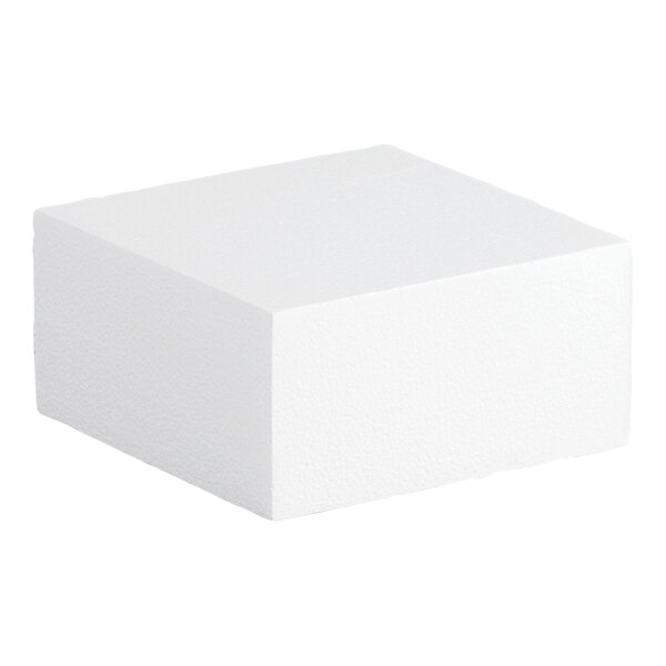 A white foam square cake dummy measuring 8 inches by 8 inches by 4 inches.
