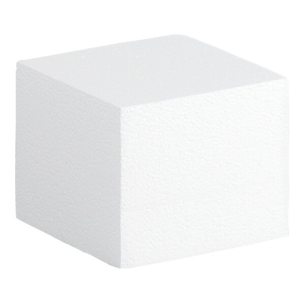 A white foam square cake dummy measuring 6 inches by 6 inches by 5 inches.