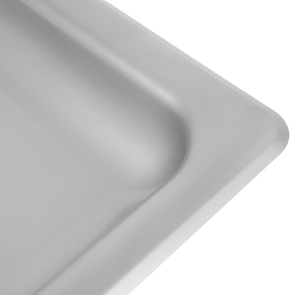 A white rectangular stainless steel feed pan with a funnel-shaped opening.