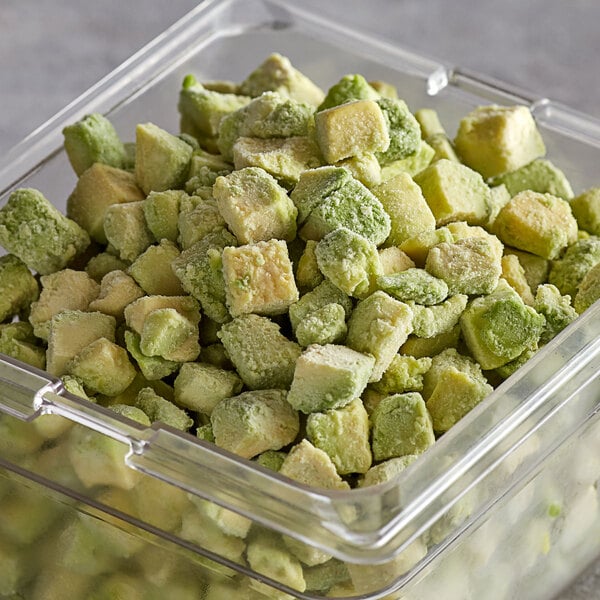 A container of IQF diced avocados on a counter.
