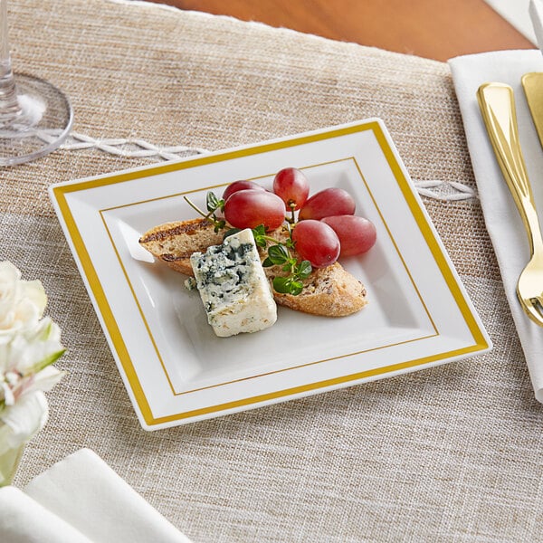 a plate of food with grapes and cheese