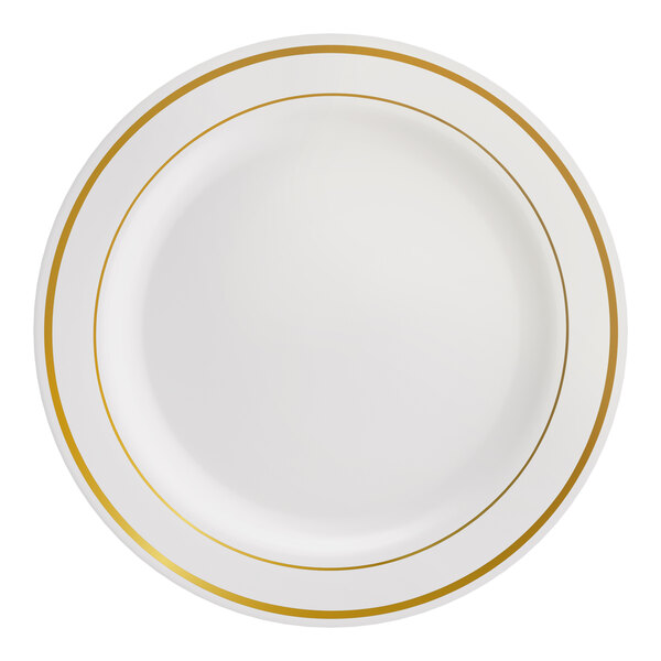 A round bone or ivory plastic plate with two gold bands near the rim.