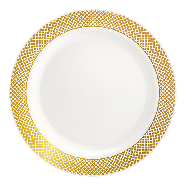 A round bone or ivory plastic plate with a gold lattice design around the rim.