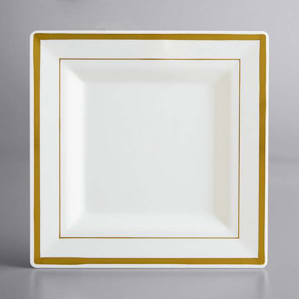 A white square plate with gold trim.