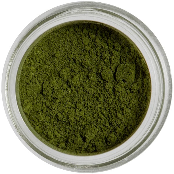 A jar of Roxy & Rich Sage Petal Dust, green powder.