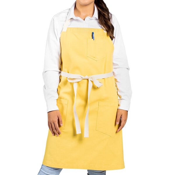 a person wearing a yellow apron