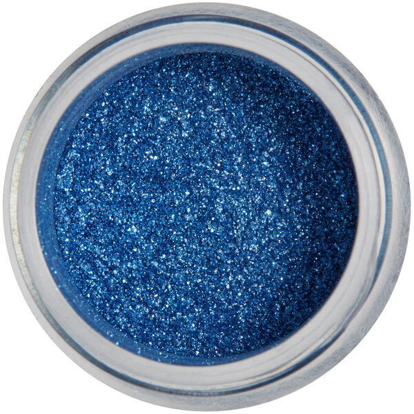 A jar of Roxy & Rich Royal Blue Sparkle Dust on a table.