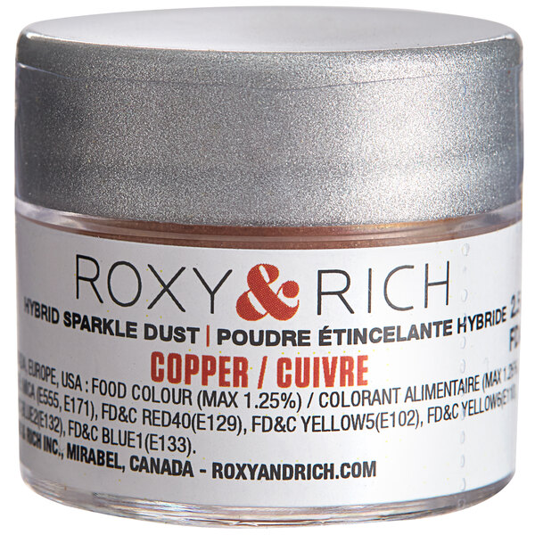 A silver jar of Roxy & Rich Copper Sparkle Dust with a white label.