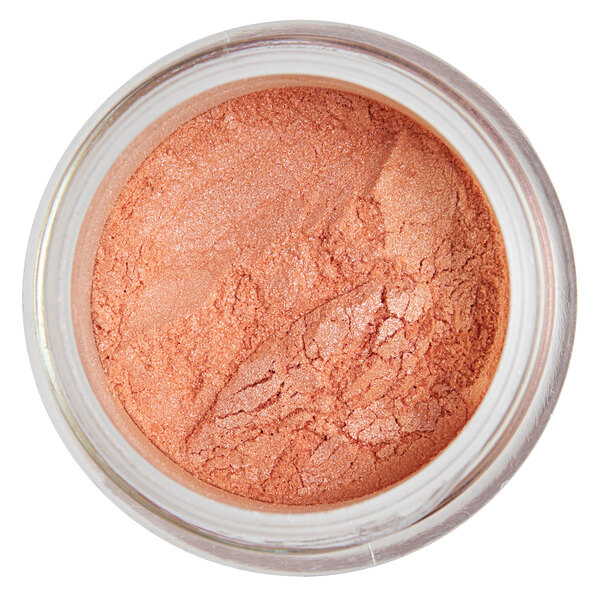 A jar of peach colored powder labeled "Roxy & Rich Magnolia Lustre Dust" on a white background.