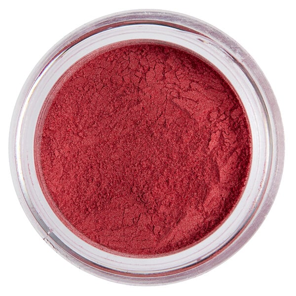 a close up of a jar of red powder