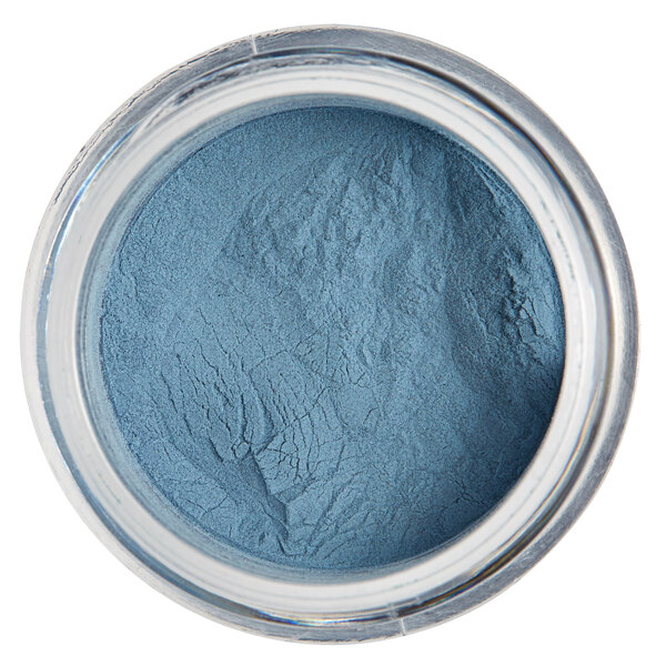 A jar of Roxy & Rich Turquoise Fondust, a blue powder.