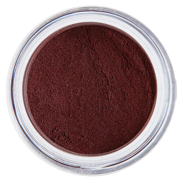 a close up of a container of brown powder