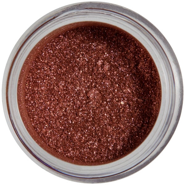 A jar of brown sparkle dust with a white label.