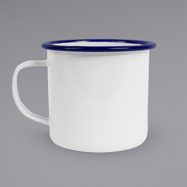 A white enamel mug with a blue rim.