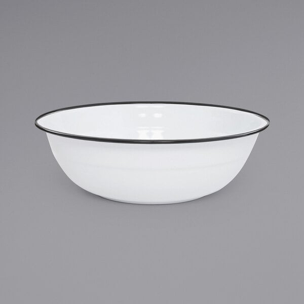 a white bowl with black rim