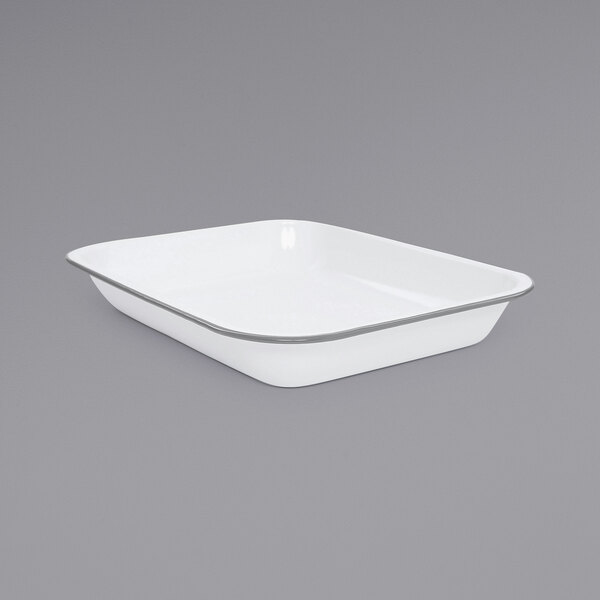 A white rectangular dish with a silver rim.