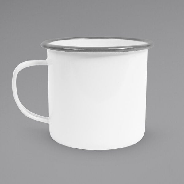 A white enamel mug with a grey rolled rim and handle.