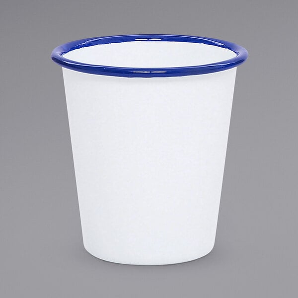 A white cup with a blue rim.