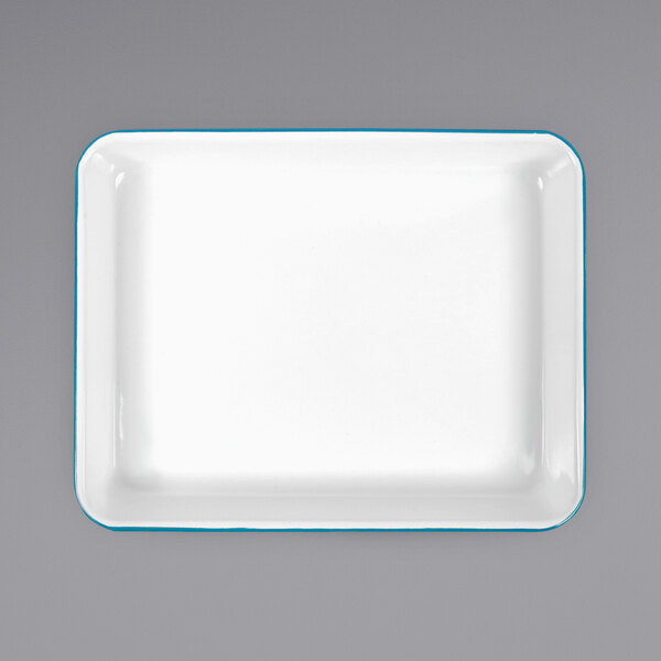 A white rectangular Crow Canyon Home enamelware tray with turquoise trim.