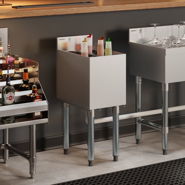 An 18-inch by 12-inch stainless steel underbar ice bin with bottle holders, designed for bar use.