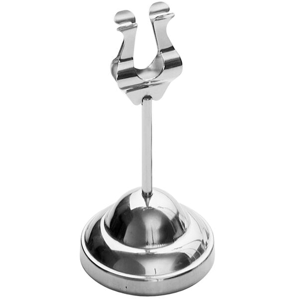 A close-up of an American Metalcraft stainless steel harp card holder with a weighted base.