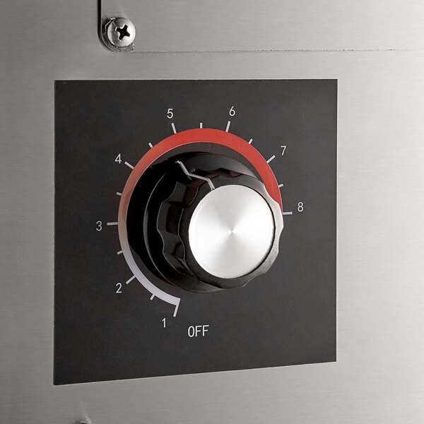 The control panel of a ServIt nacho chip warmer with a dial and numbers.