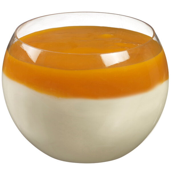 a bowl of orange and white dessert