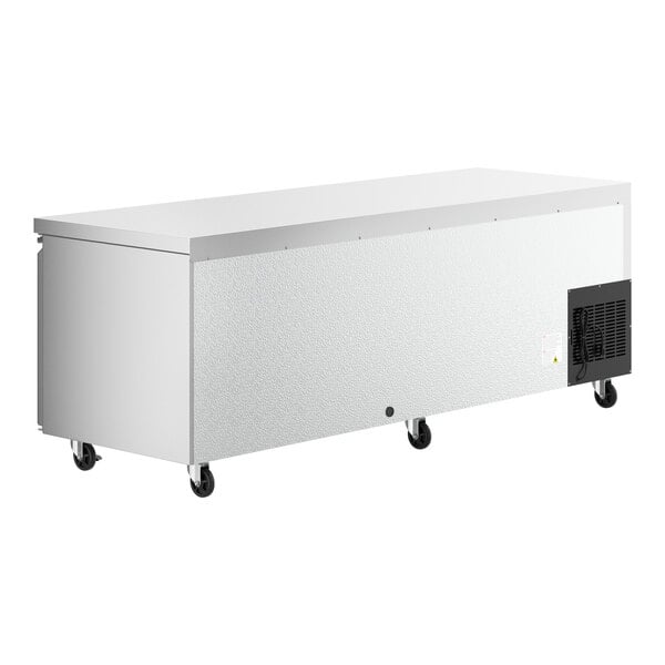 A stainless steel rectangular refrigerator with wheels.