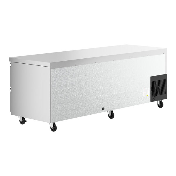 A white rectangular Avantco undercounter refrigerator with wheels.