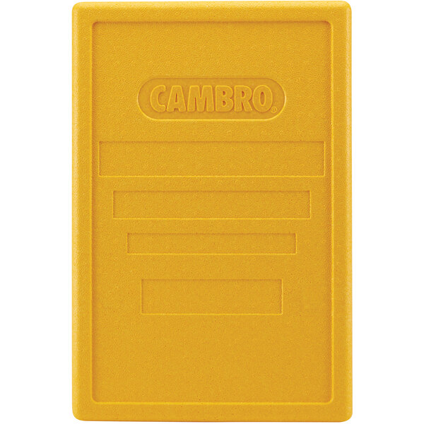 A yellow plastic rectangular lid with text.