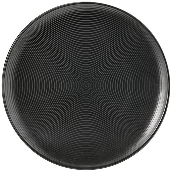 A Front of the House semi-matte black porcelain plate with a spiral pattern.