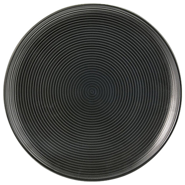 A Front of the House semi-matte black porcelain plate with spiral lines on it.