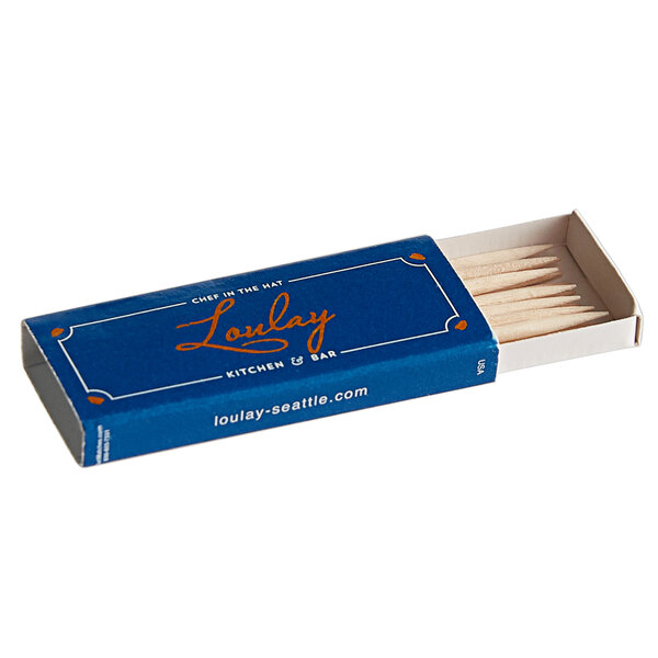 A blue box with white text that reads "20-Count Customizable Toothpick Box" containing 20 boxes of toothpicks.