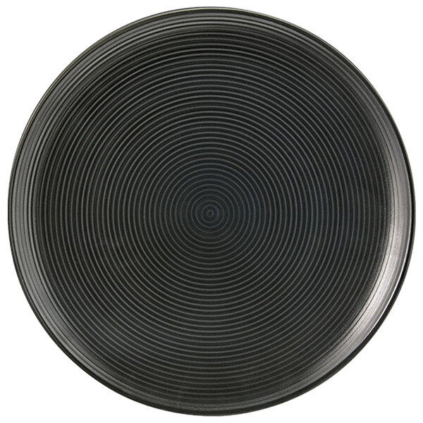 A Front of the House semi-matte black porcelain plate with a spiral design.