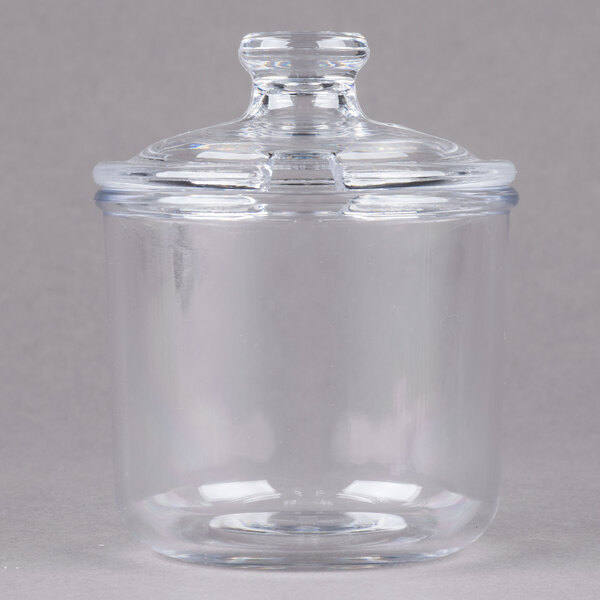 A clear Cambro Camwear condiment jar with a slotted lid.