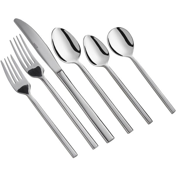 An Acopa Phoenix stainless steel dinner fork with other silverware.