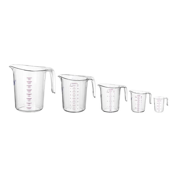 A row of clear plastic measuring cups with purple writing and handles.