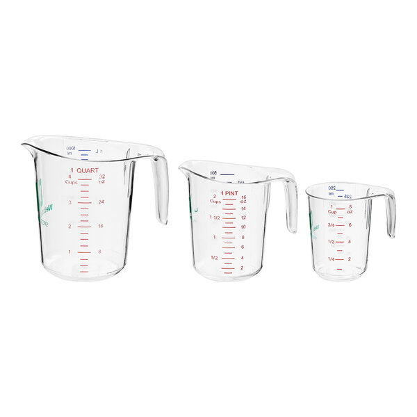 A group of clear plastic measuring cups with purple writing.