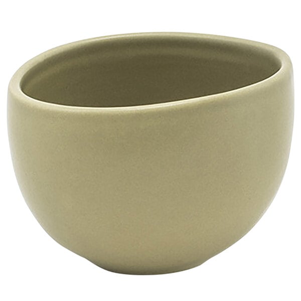 A close up of a Front of the House Tides sea grass porcelain bowl on a white background.