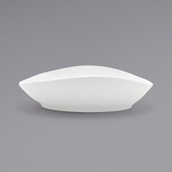 A Front of the House Tides white porcelain bowl with a curved edge on a white background.