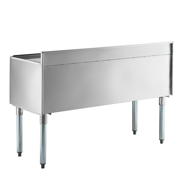 A Regency stainless steel rectangular underbar ice bin with sliding lid and bottle holders.