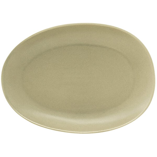 A close-up of the front of a white oval Tides porcelain plate with a shadow.